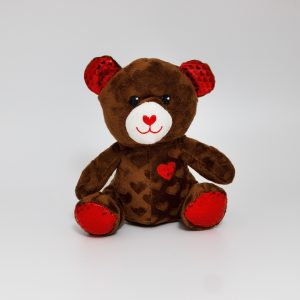 Cute plush teddy bear with heart decorations, perfect for Valentine's Day gifts or decoration.