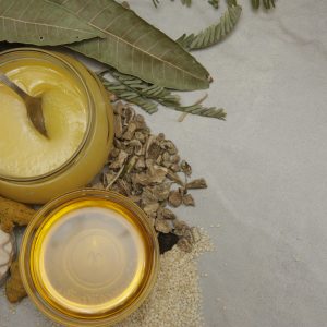 A top-view of natural ingredients including honey, herbs, and leaves, perfect for healthy lifestyle themes.